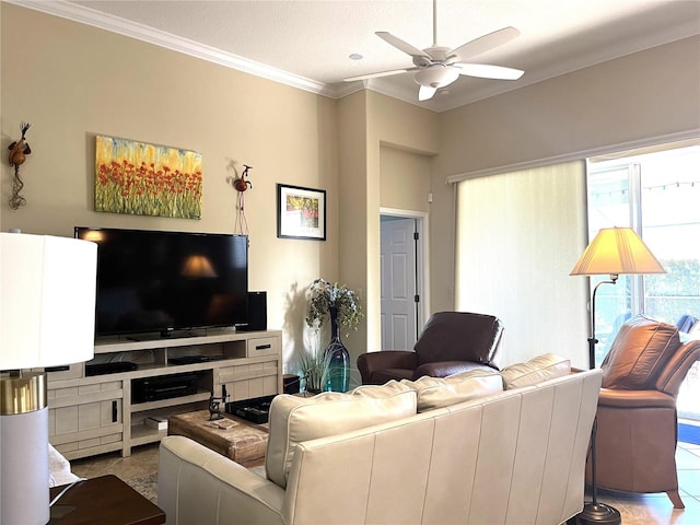 tiled living room with ornamental molding, a textured ceiling, and ceiling fan