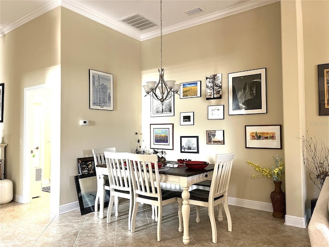 dining area featuring crown molding and a chandelier