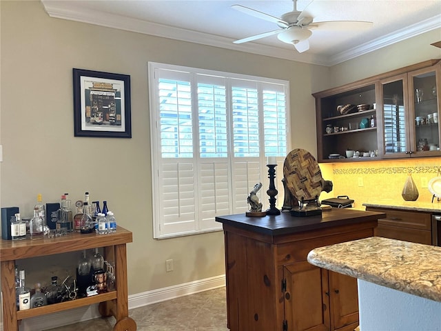 tiled home office featuring ornamental molding and ceiling fan