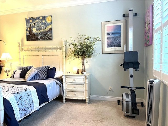 carpeted bedroom with ornamental molding and heating unit