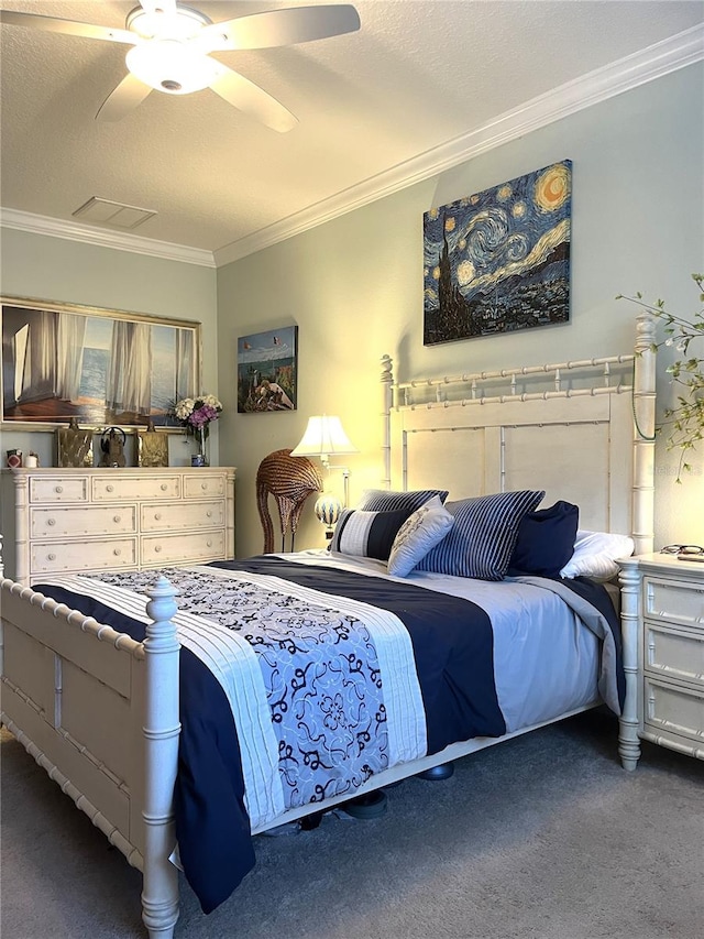 bedroom featuring ornamental molding, dark colored carpet, a textured ceiling, and ceiling fan