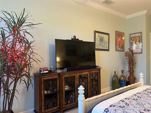 bedroom with ornamental molding