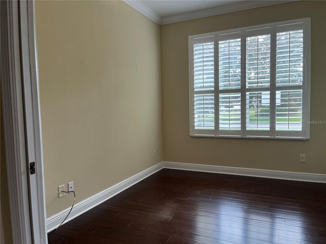 empty room featuring crown molding and dark wood-type flooring