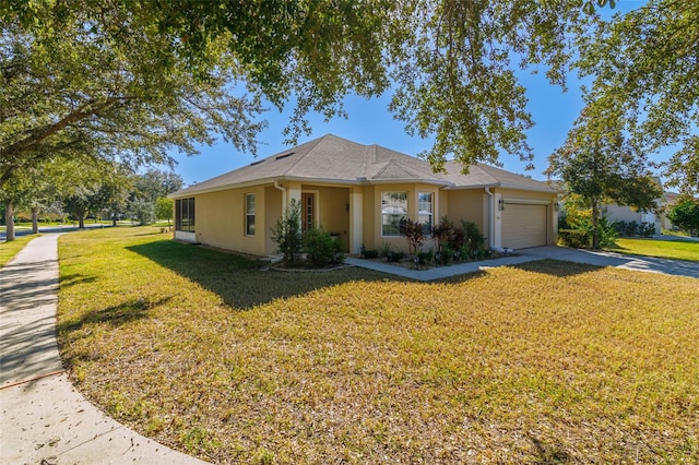 ranch-style home with a garage and a front yard