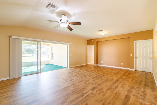 empty room with light hardwood / wood-style floors, ceiling fan, and vaulted ceiling