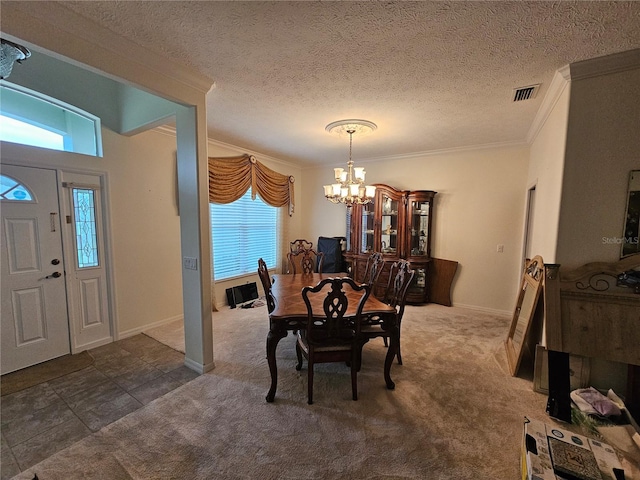 carpeted dining area with an inviting chandelier, crown molding, and a textured ceiling