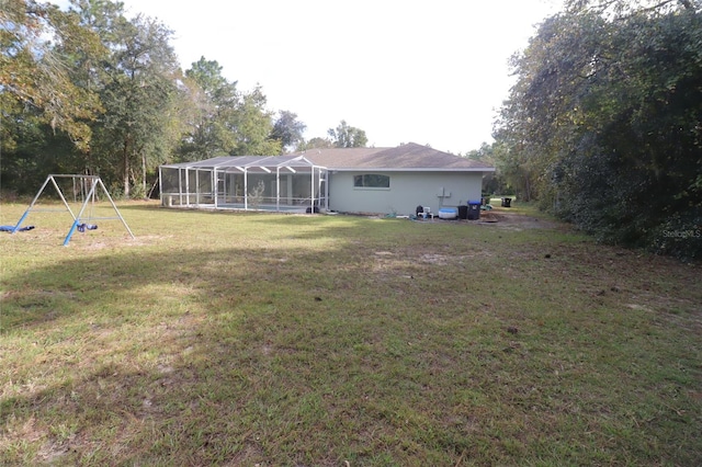 view of yard featuring glass enclosure