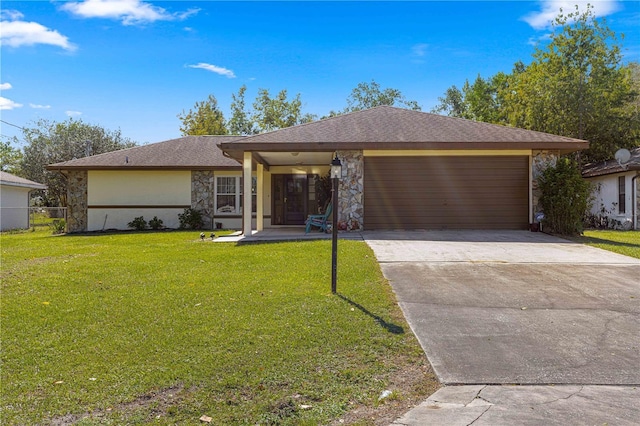 ranch-style house featuring a garage and a front yard