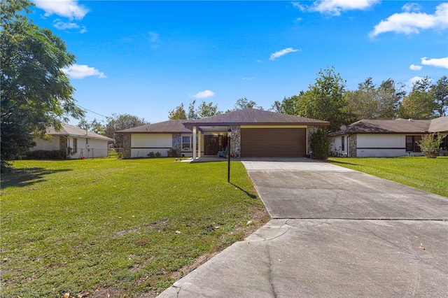 ranch-style house featuring a garage and a front yard