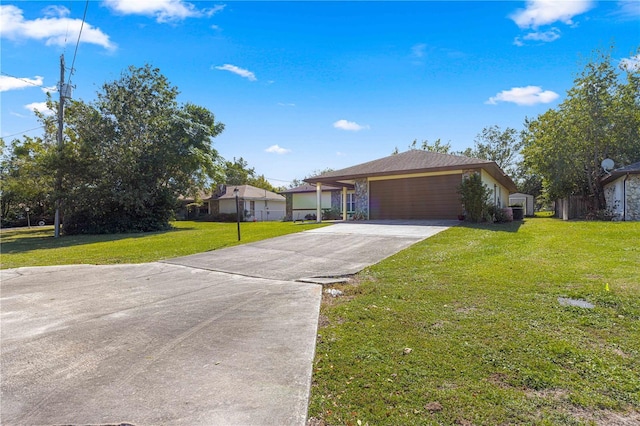 ranch-style house with a garage and a front yard