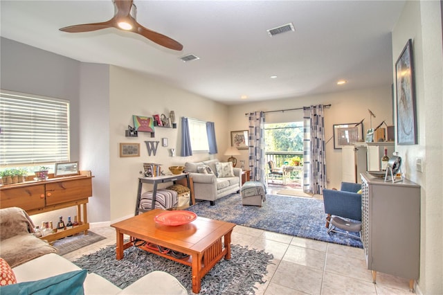 living room with light tile patterned floors and ceiling fan