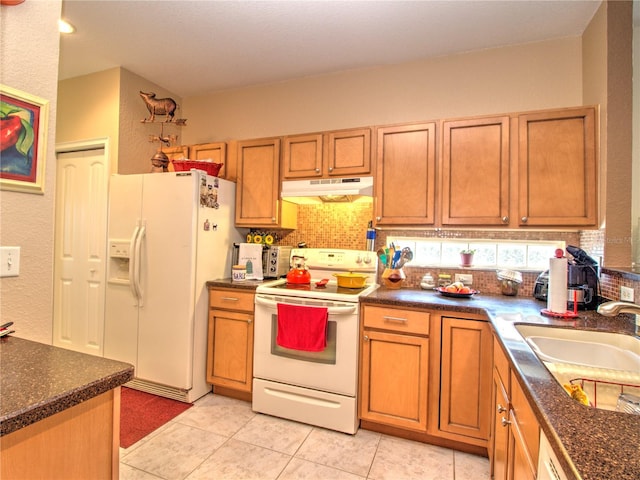 kitchen featuring decorative backsplash, light tile patterned floors, white appliances, and sink