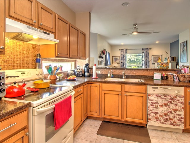 kitchen with dishwasher, light tile patterned flooring, sink, and white range with electric stovetop