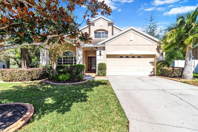 view of front of home with a garage and a front lawn