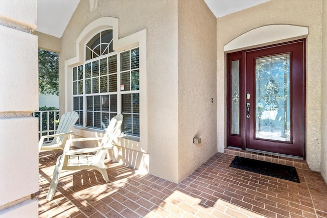 doorway to property with a porch