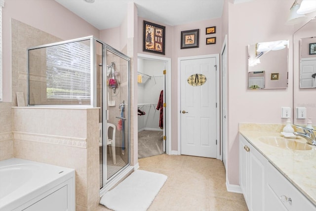 bathroom featuring vanity, tile patterned floors, and plus walk in shower