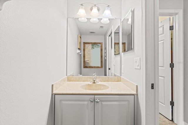 bathroom featuring vanity and tile patterned flooring