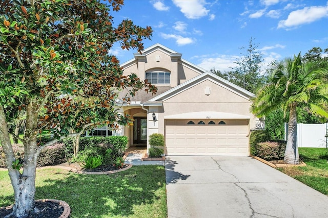 view of front of property featuring a garage and a front yard