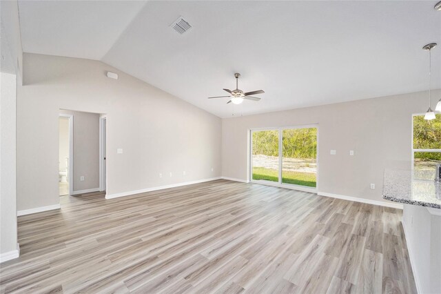 spare room with light hardwood / wood-style floors, lofted ceiling, and ceiling fan