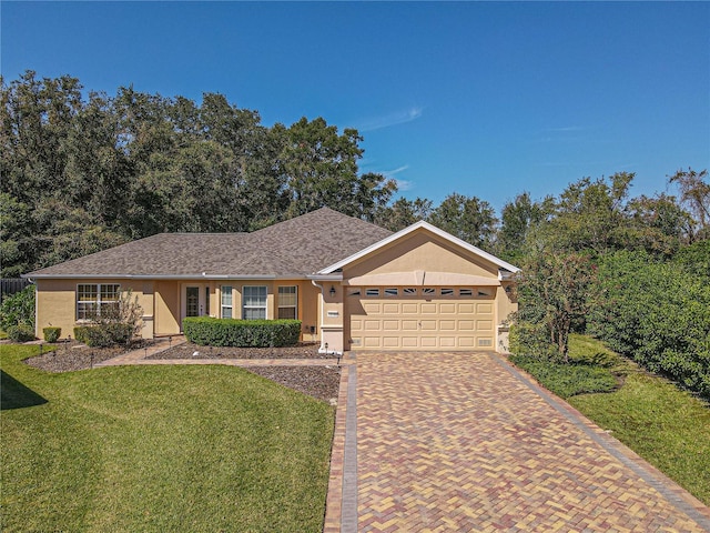 ranch-style home featuring a front lawn and a garage