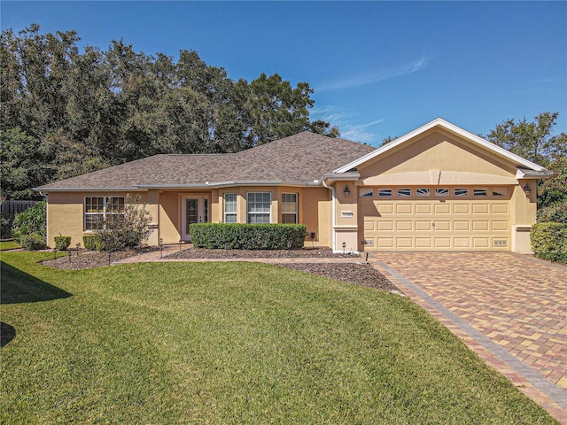 ranch-style house with a front yard and a garage