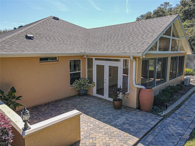 rear view of property with a patio and french doors