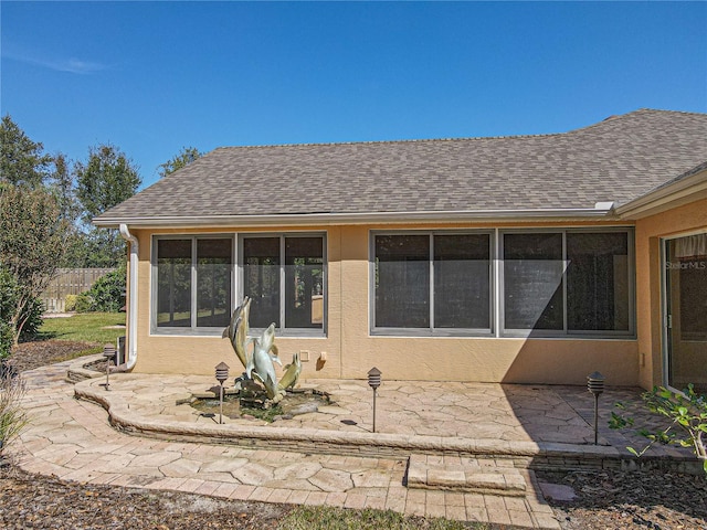 back of property with a patio area