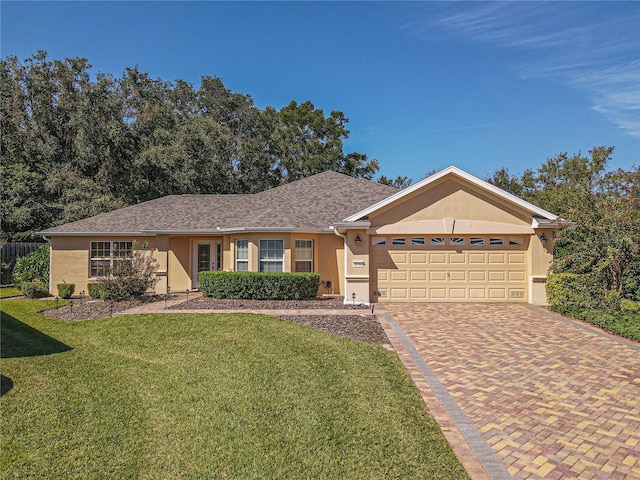 single story home with a front yard and a garage