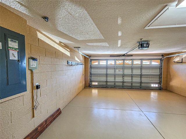 garage featuring a garage door opener and electric panel