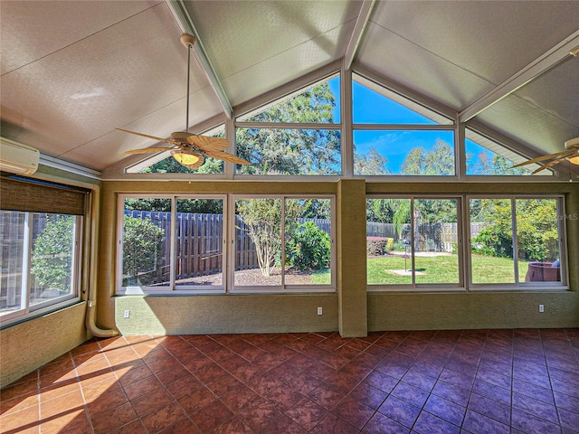 unfurnished sunroom featuring vaulted ceiling, ceiling fan, a wall mounted air conditioner, and plenty of natural light