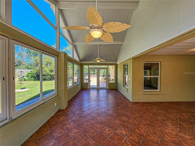 unfurnished sunroom with french doors, lofted ceiling with beams, and ceiling fan