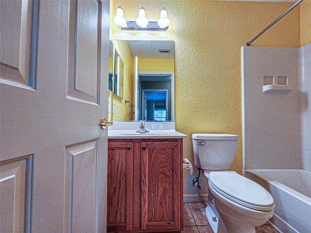 full bathroom featuring toilet, shower / tub combination, vanity, and tile patterned flooring