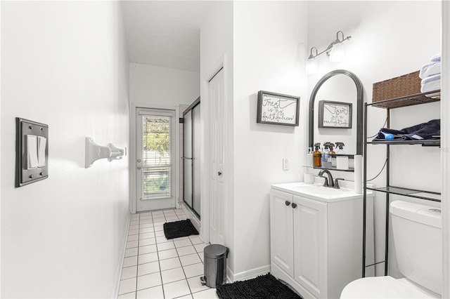 bathroom featuring tile patterned flooring, vanity, and toilet