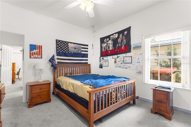 bedroom featuring ceiling fan and light colored carpet