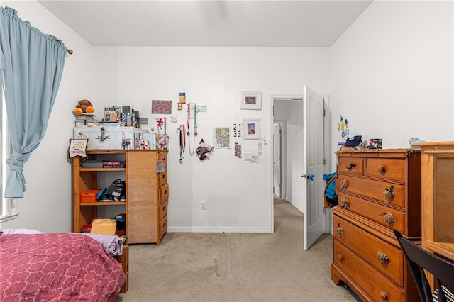 bedroom featuring light carpet