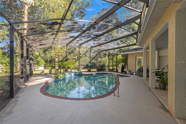 view of swimming pool with a lanai and a patio area