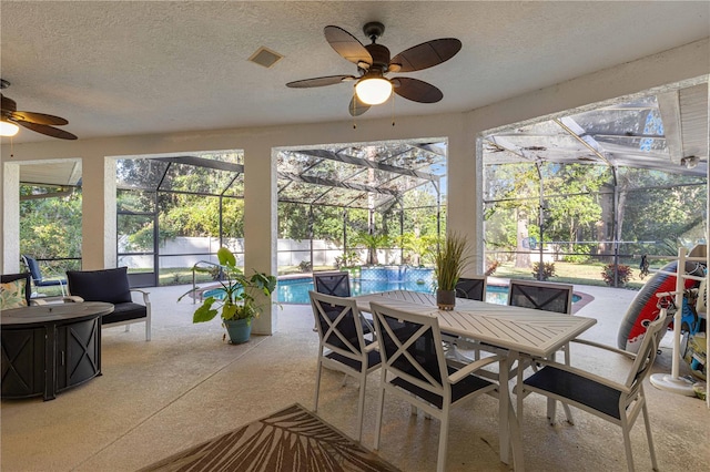 sunroom / solarium with ceiling fan