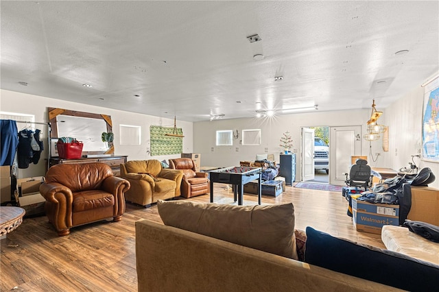 living room featuring hardwood / wood-style flooring and a textured ceiling