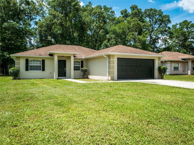 ranch-style home featuring a front lawn and a garage