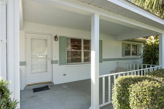 doorway to property featuring covered porch