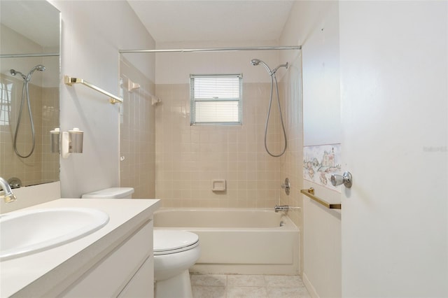 full bathroom with toilet, tiled shower / bath combo, vanity, and tile patterned flooring