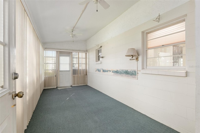 unfurnished sunroom with vaulted ceiling and ceiling fan