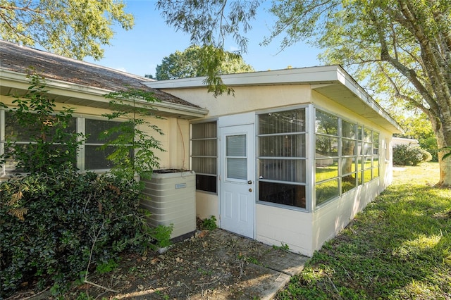 doorway to property with central air condition unit