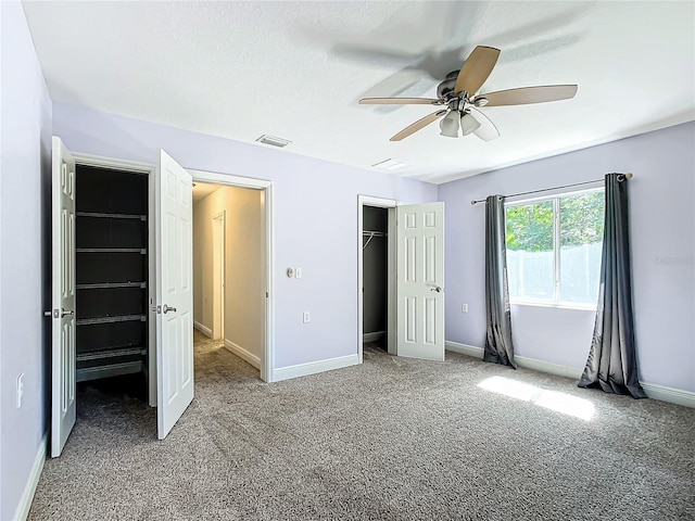 unfurnished bedroom with ceiling fan and carpet flooring