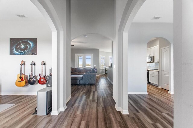 hall featuring french doors and dark wood-type flooring