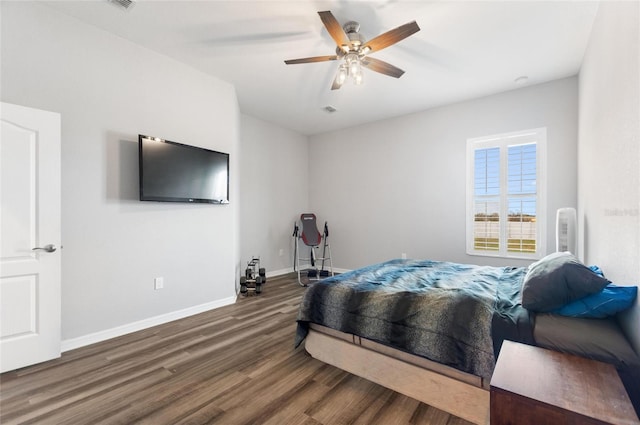 bedroom featuring ceiling fan and dark hardwood / wood-style flooring