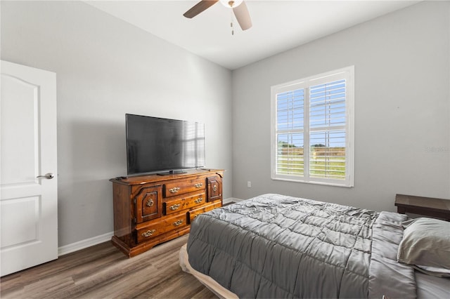 bedroom featuring hardwood / wood-style floors and ceiling fan