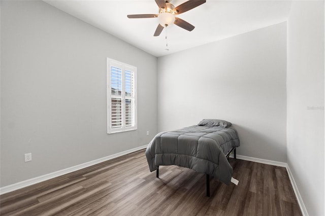 bedroom with dark wood-type flooring and ceiling fan