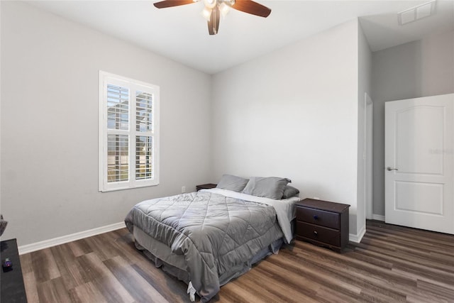 bedroom featuring ceiling fan and dark hardwood / wood-style floors