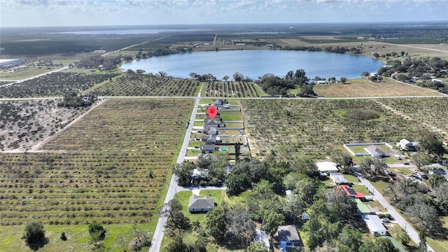 drone / aerial view with a rural view and a water view